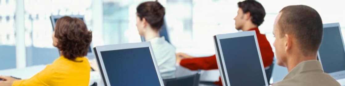 People working and looking at computer monitors