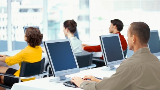 People working and looking at computer monitors