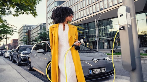 Women standing at shell  ev gas station