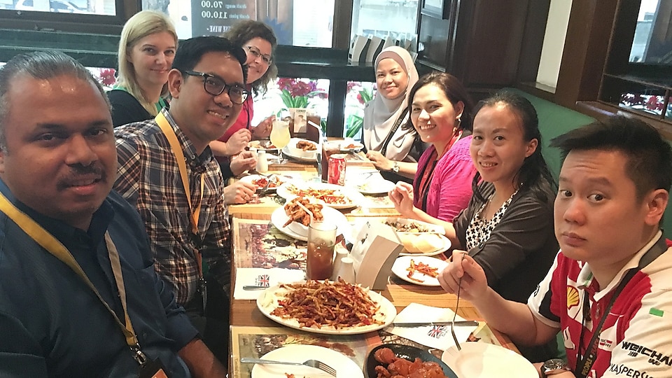 Maria and colleagues having dinner in a restaurant in Manila