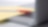 Photo of red pan on yellow piece of paper, placed on the keyboard of a laptop