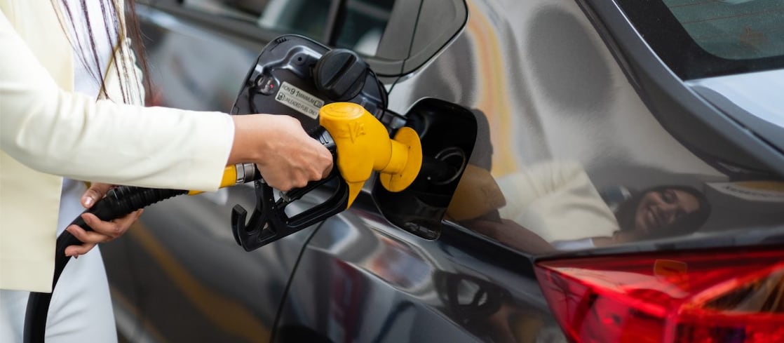 Girl refueling her vehicle
