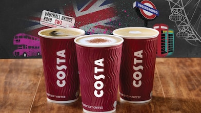Three cups of costa coffee with british themed background