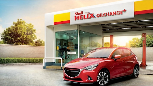 shell helix oil change plus with red car
