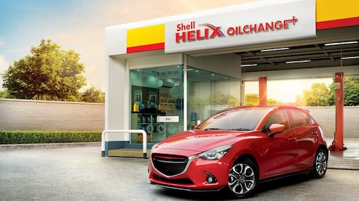 shell helix oil change plus with red car