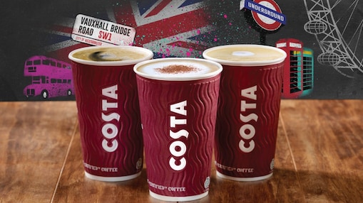 Three cups of costa coffee with british themed background